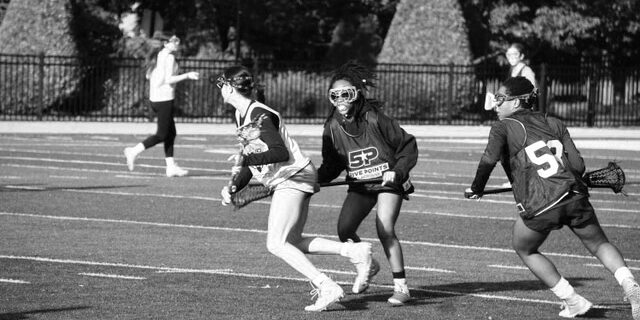 girls playing lacrosse outdoors nyc